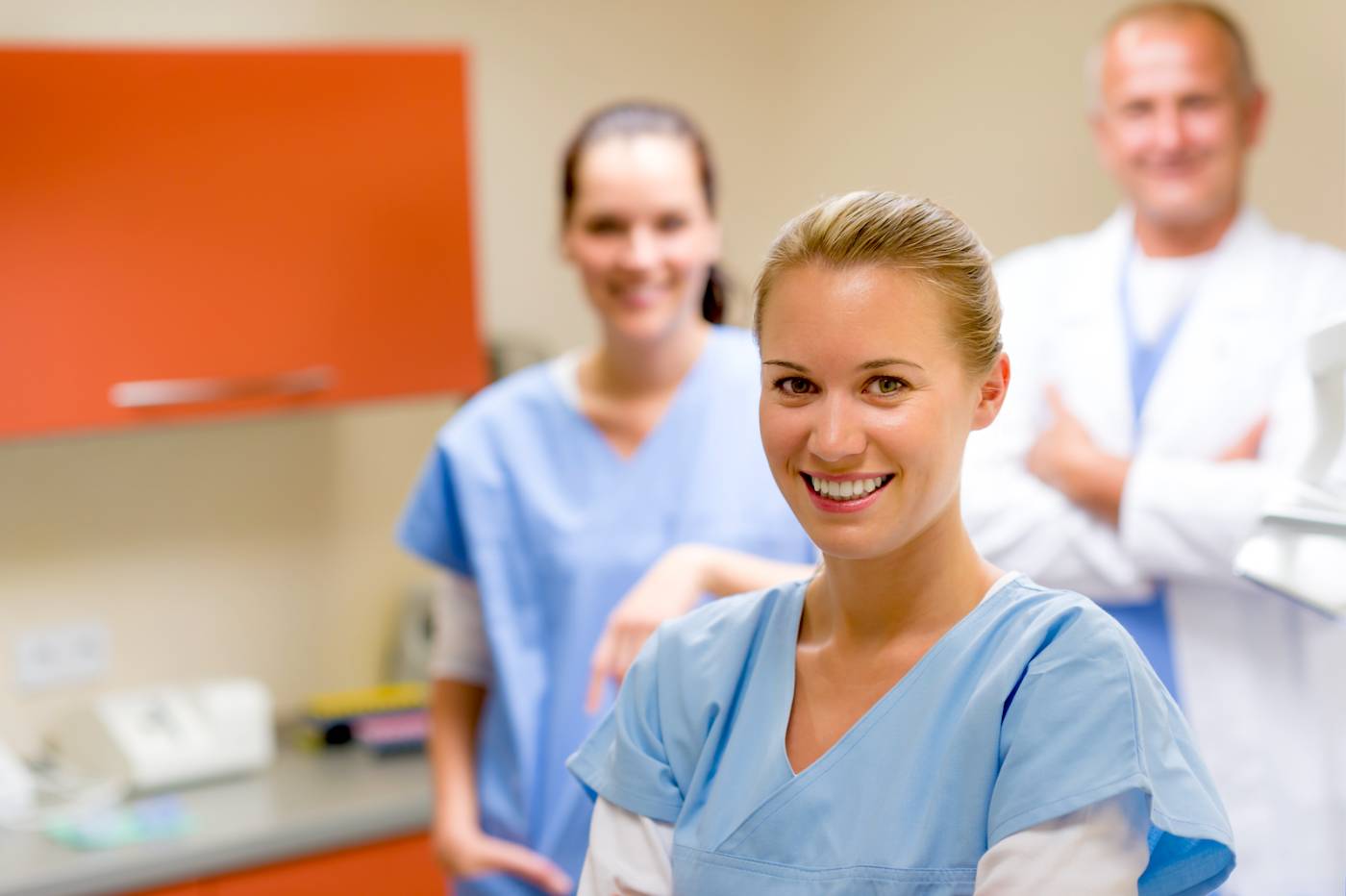 Female nursing student smiling in medical office